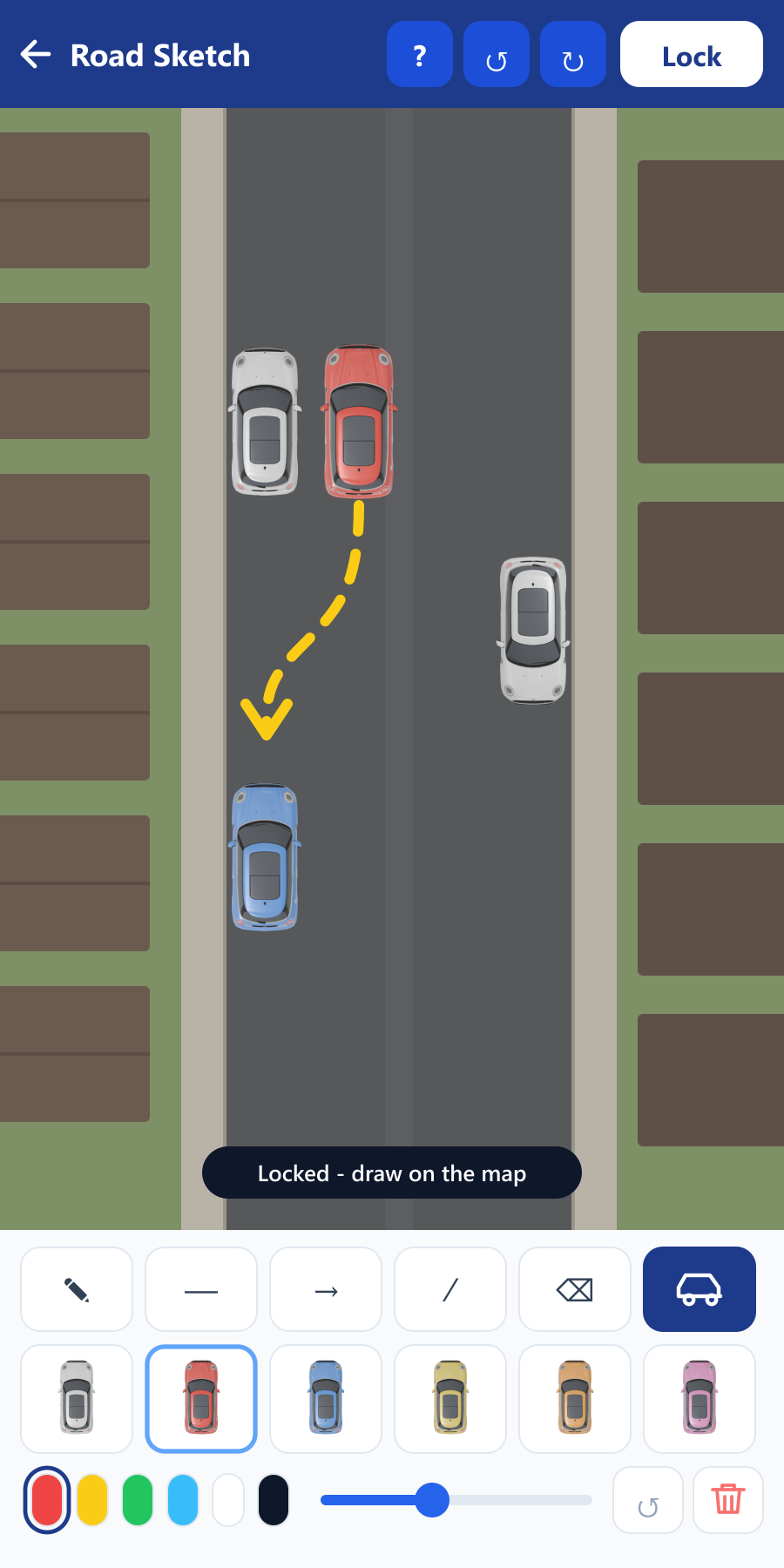 Road Sketch showing cars placed on an aerial view of a street with a dashed reversing path drawn in